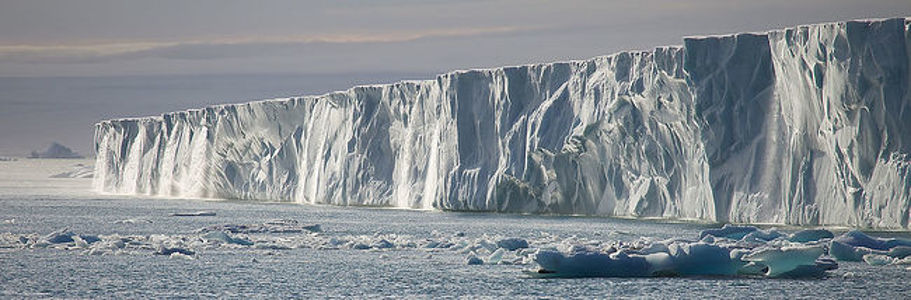This image features the vast Austfonna ice cap on Nordaustlandet in the Svalbard archipelago, with its impressive ice cliffs plunging into the Arctic Ocean. The scene highlights the stark and pristine environment of the polar region, capturing the ice cap’s grandeur and the tranquility of this remote locale. Ideal for bringing a sense of the planet’s untouched wilderness into any space.