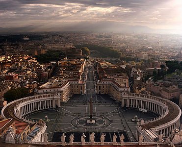 Take in the breathtaking view of St. Peter’s Square from above, as the early light casts a serene glow over Vatican City’s historic architecture.